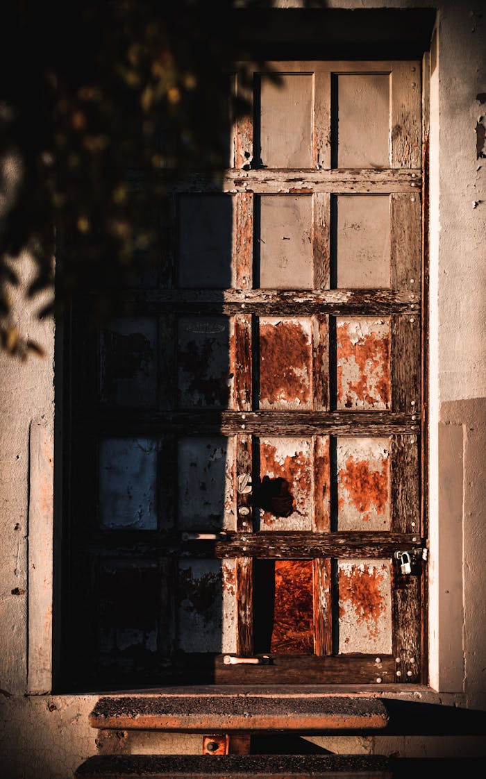 services-02 A weathered and rustic wooden door captured in the warm sunset light of Phoenix, Arizona.